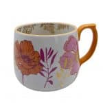 Taza floral de cerámica con tonos cálidos - Image 4