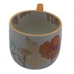 Taza floral de cerámica con tonos cálidos - Image 5